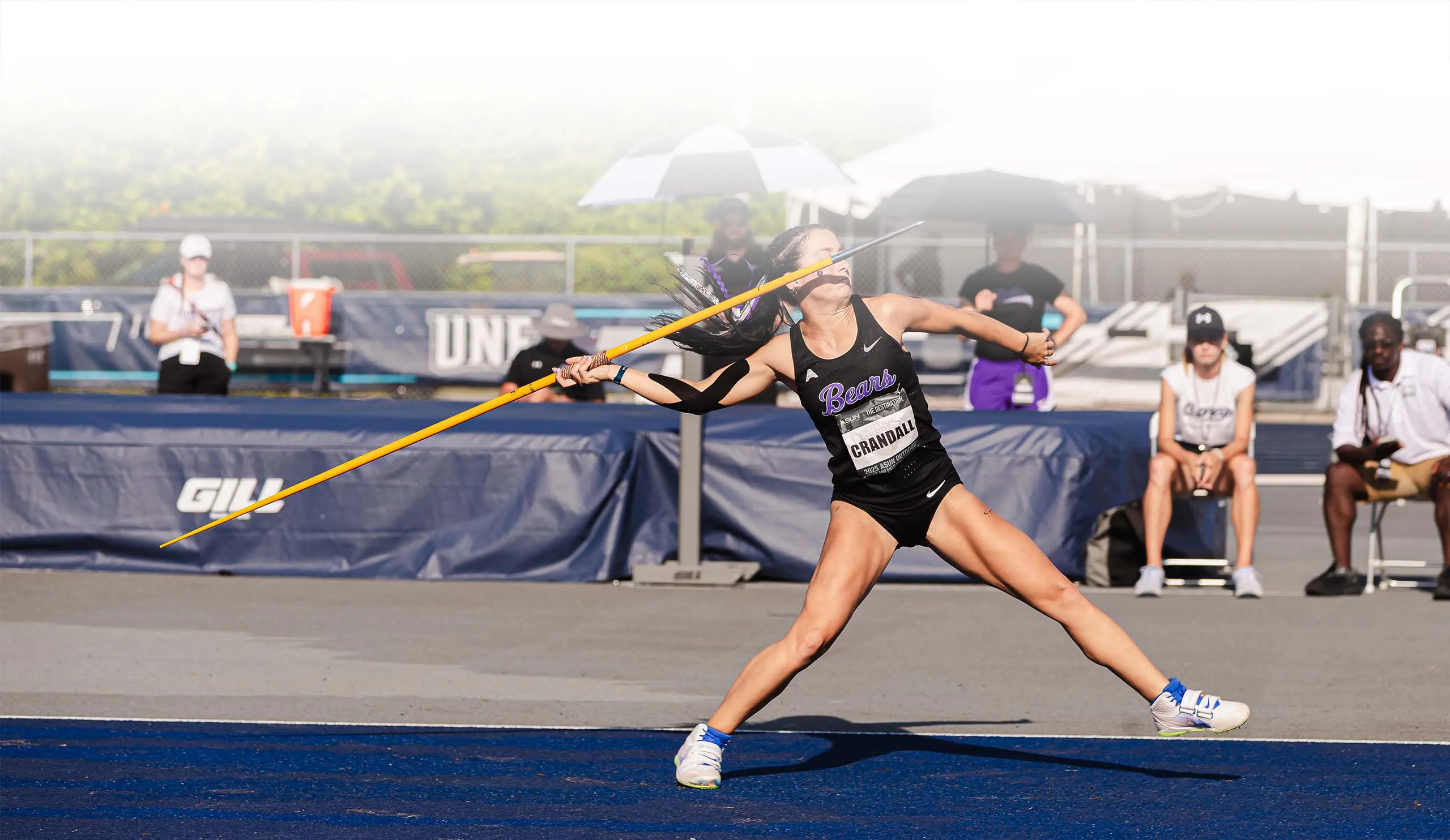 Track athlete jumping water hurdle