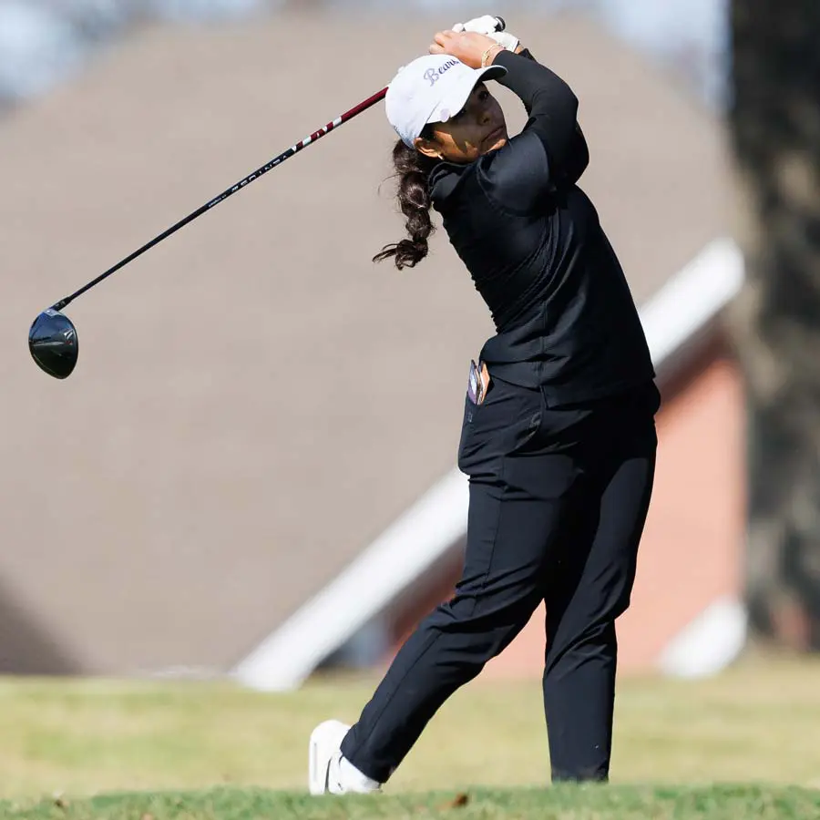 two female tennis players giving each other a fist bump